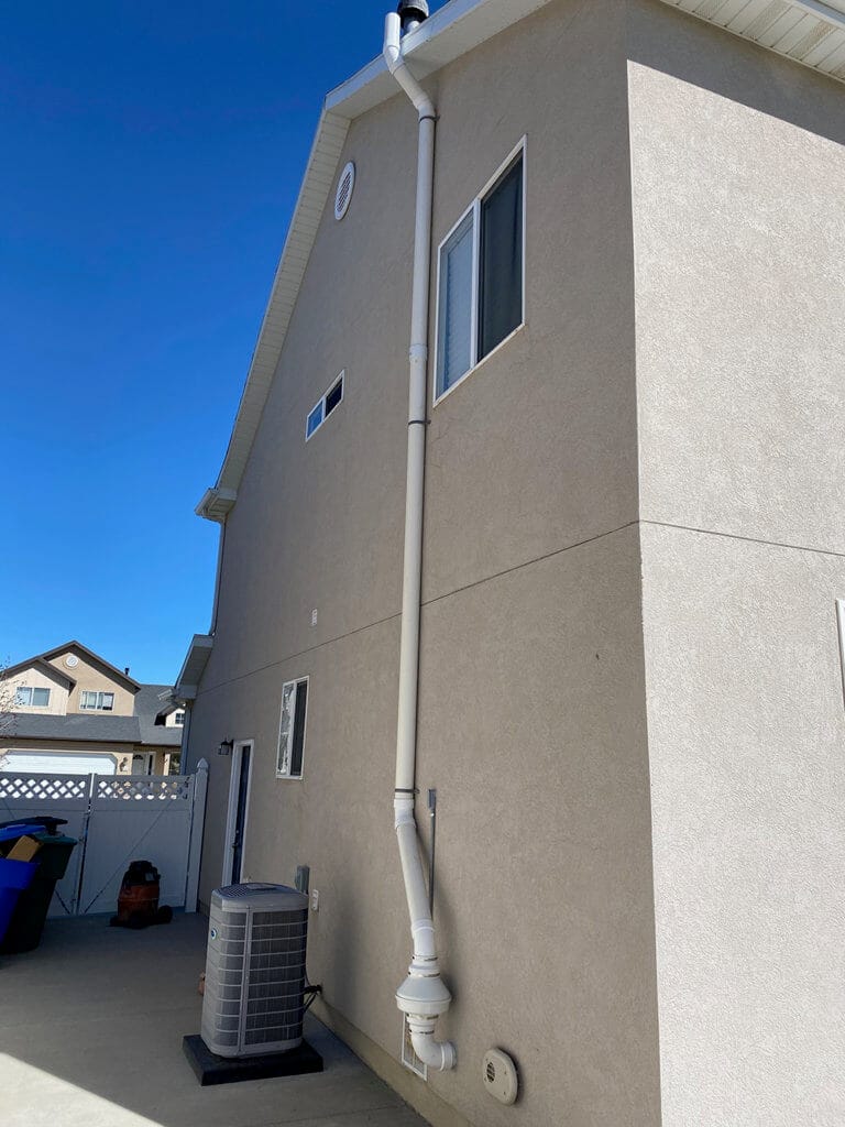 radon mitigation system outside a home